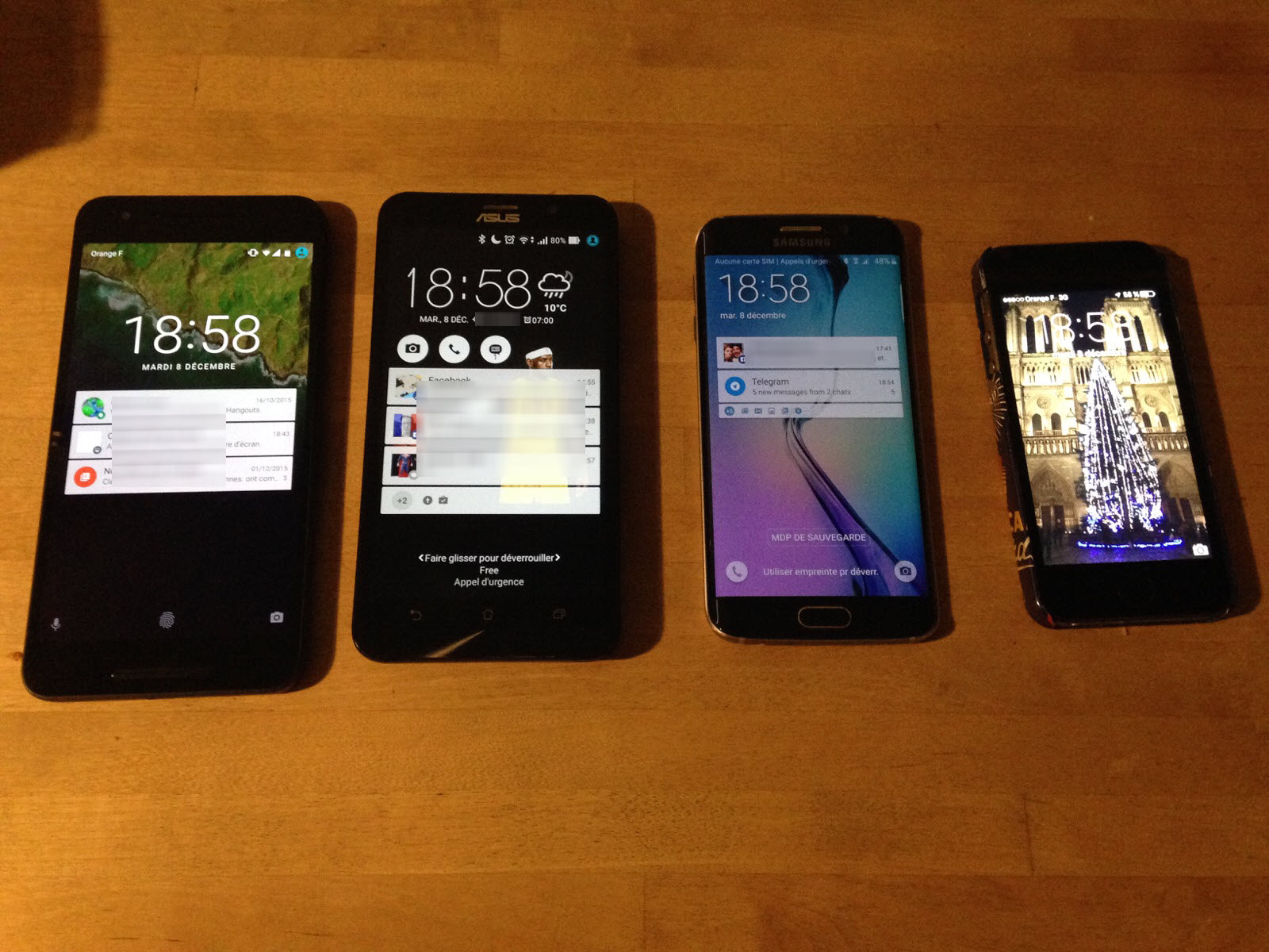 Le Nexus 6P comparé (de gauche à droite) au Zenphone 2 d'ASUS, au Galaxy S6 Edge de Samsung, et à l'iPhone 5S d'Apple